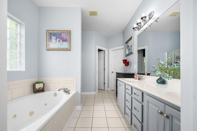 116 Macy Ct, Christiana, TN 37037 - bathroom featuring double vanity, a tub with jets, baseboards, and tile patterned flooring