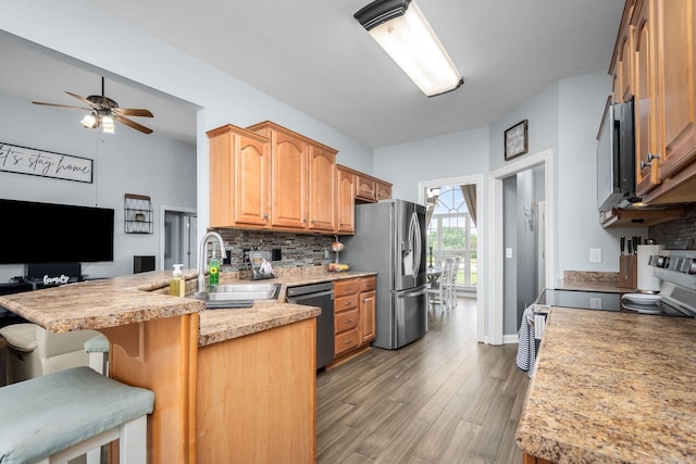 116 Macy Ct, Christiana, TN 37037 - kitchen featuring stainless steel refrigerator with ice dispenser, dishwasher, a sink, a peninsula, and tasteful backsplash