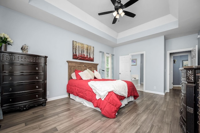 116 Macy Ct, Christiana, TN 37037 - bedroom featuring a raised ceiling, wood finished floors, baseboards, connected bathroom, and ceiling fan