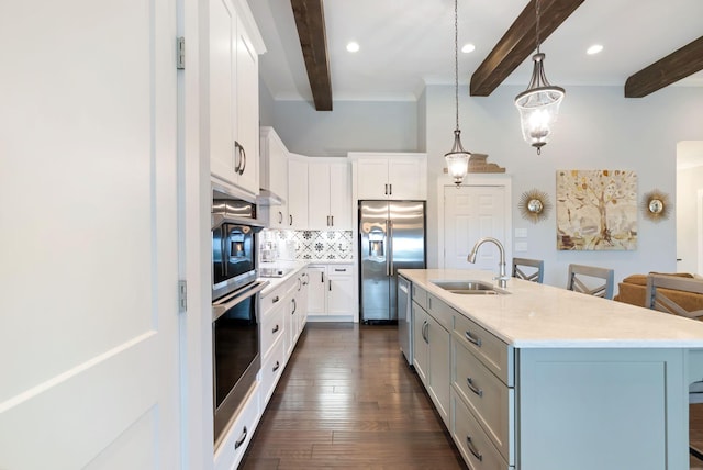140 Split Rail Ln, Spring Hill, TN 37174 - kitchen featuring a sink, stainless steel appliances, beam ceiling, decorative backsplash, and white cabinets
