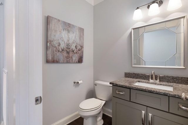 140 Split Rail Ln, Spring Hill, TN 37174 - bathroom with vanity, toilet, baseboards, and wood finished floors