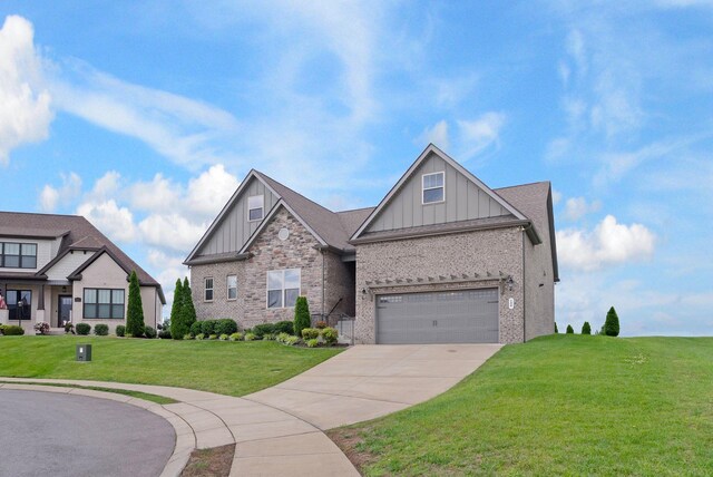 140 Split Rail Ln, Spring Hill, TN 37174 - craftsman-style home featuring board and batten siding, driveway, a front lawn, and brick siding