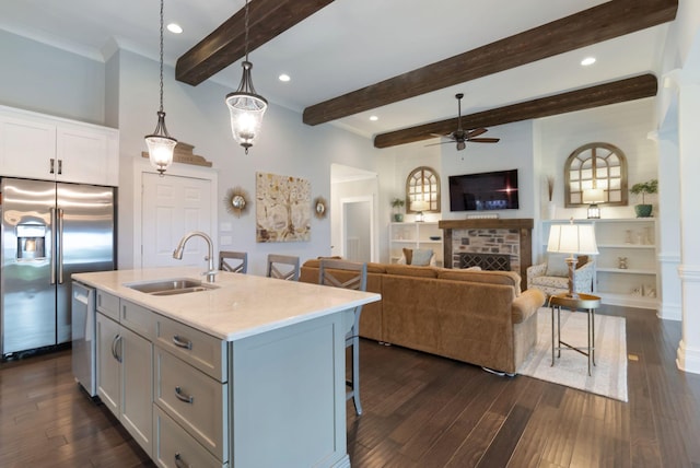 140 Split Rail Ln, Spring Hill, TN 37174 - kitchen featuring appliances with stainless steel finishes, a sink, ceiling fan, a breakfast bar area, and open floor plan