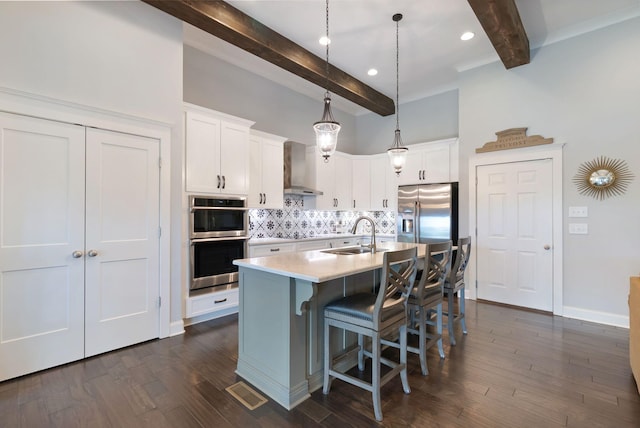 140 Split Rail Ln, Spring Hill, TN 37174 - kitchen featuring a sink, beam ceiling, stainless steel appliances, backsplash, and light countertops