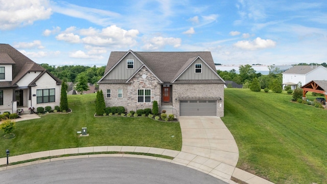 140 Split Rail Ln, Spring Hill, TN 37174 - view of front of property featuring board and batten siding, driveway, a front yard, an attached garage, and brick siding