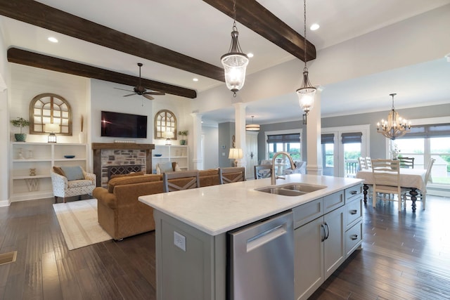 140 Split Rail Ln, Spring Hill, TN 37174 - kitchen with a sink, stainless steel dishwasher, a ceiling fan, pendant lighting, and a fireplace