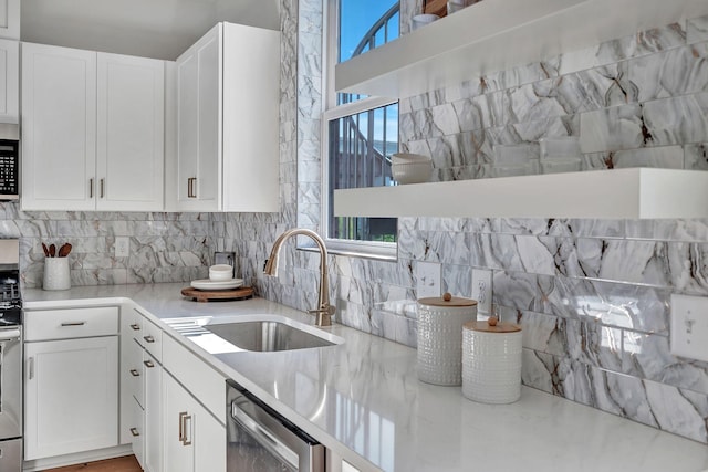 603 51st Ave, Nashville, TN 37209 - kitchen with a sink, decorative backsplash, and white cabinetry