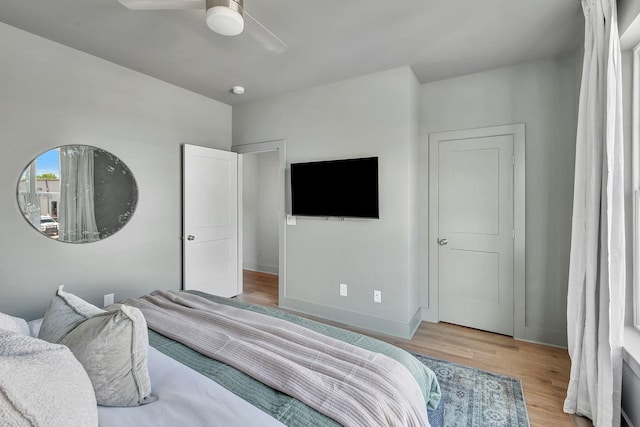 603 51st Ave, Nashville, TN 37209 - bedroom featuring light wood-style floors, a ceiling fan, and baseboards
