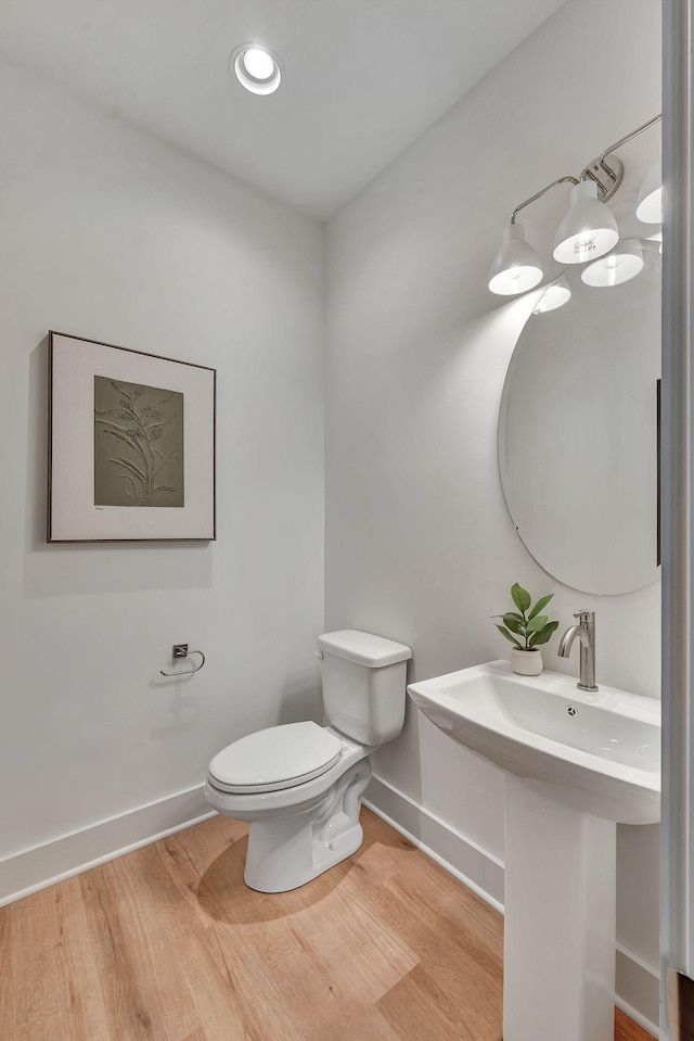 603 51st Ave, Nashville, TN 37209 - bathroom with wood finished floors, baseboards, toilet, and a sink