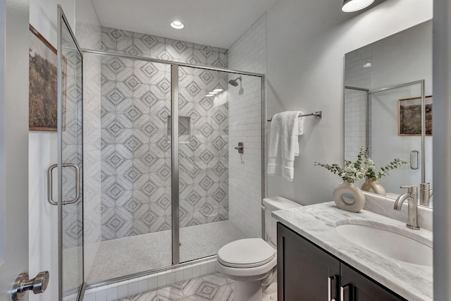 603 51st Ave, Nashville, TN 37209 - bathroom featuring vanity, toilet, a stall shower, and recessed lighting