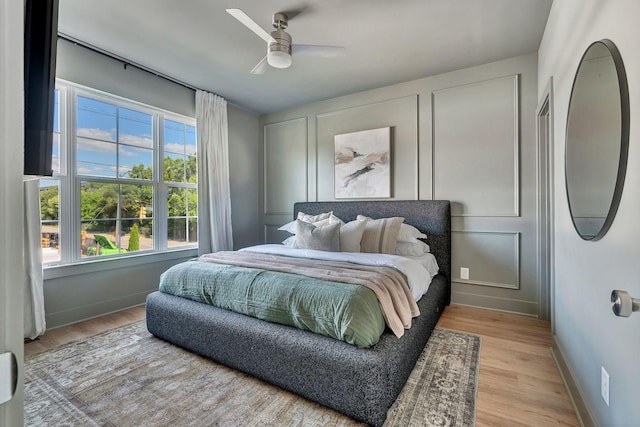 603 51st Ave, Nashville, TN 37209 - bedroom with baseboards, light wood-style flooring, and a ceiling fan