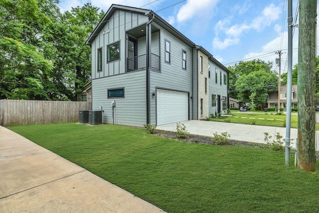 415 S University St, Murfreesboro, TN 37130 - view of side of home with concrete driveway, board and batten siding, a garage, and cooling unit