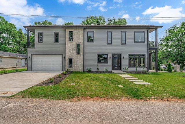 415 S University St, Murfreesboro, TN 37130 - view of front of home featuring a garage, a front yard, concrete driveway, and a balcony