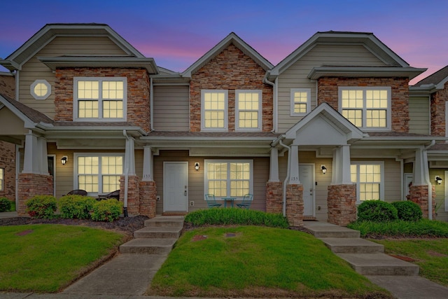 133 Cobblestone Place Dr, Goodlettsville, TN 37072 - view of front of home featuring covered porch, a lawn, and stone siding