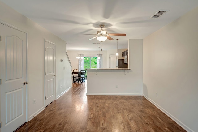 133 Cobblestone Place Dr, Goodlettsville, TN 37072 - unfurnished living room with ceiling fan, dark wood-style floors, a chandelier, and baseboards