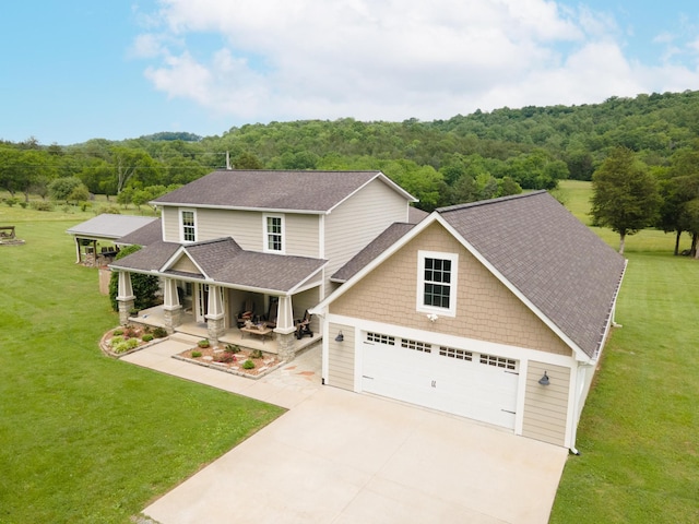 29 Roger Monk Rd, Petersburg, TN 37144 - craftsman inspired home featuring covered porch, a garage, a wooded view, and driveway
