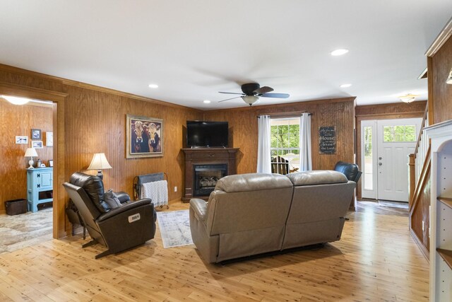 29 Roger Monk Rd, Petersburg, TN 37144 - living room with a ceiling fan, a fireplace, light wood-type flooring, wood walls, and recessed lighting