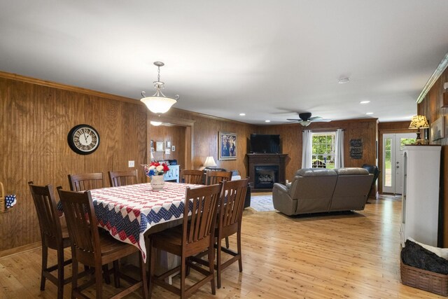 29 Roger Monk Rd, Petersburg, TN 37144 - dining area with wood walls, a ceiling fan, a fireplace, light wood-style flooring, and recessed lighting