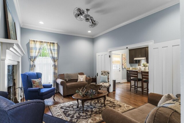 29 Roger Monk Rd, Petersburg, TN 37144 - living room featuring healthy amount of natural light, ornamental molding, wood finished floors, and recessed lighting