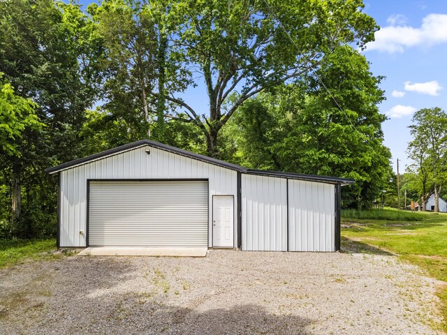 29 Roger Monk Rd, Petersburg, TN 37144 - detached garage featuring gravel driveway and view of wooded area