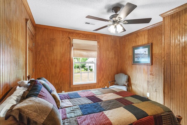 29 Roger Monk Rd, Petersburg, TN 37144 - bedroom featuring ornamental molding, wood walls, ceiling fan, and a textured ceiling