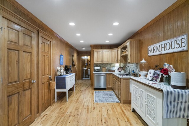 29 Roger Monk Rd, Petersburg, TN 37144 - kitchen featuring stainless steel dishwasher, wood walls, light countertops, a sink, and light wood-type flooring