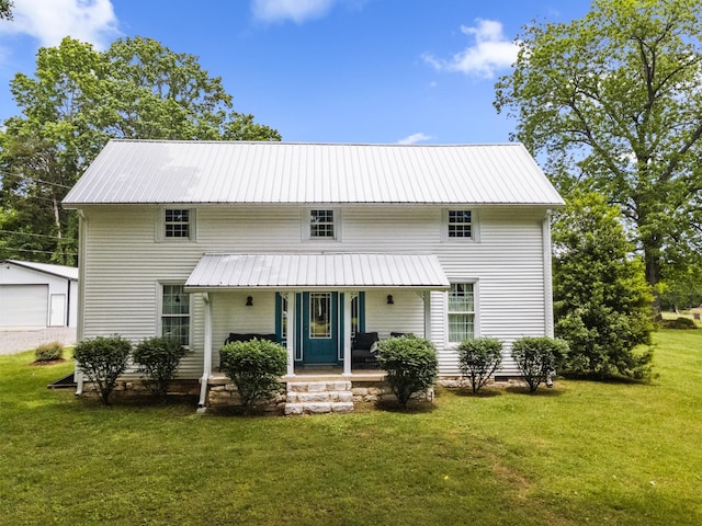 29 Roger Monk Rd, Petersburg, TN 37144 - view of front of property featuring covered porch, a front lawn, metal roof, a detached garage, and an outdoor structure