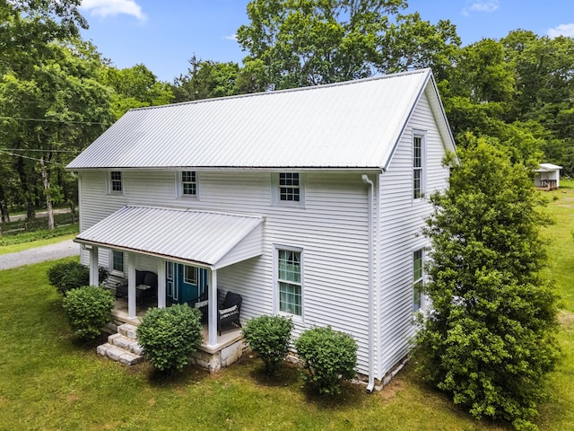 29 Roger Monk Rd, Petersburg, TN 37144 - rear view of house featuring metal roof, a lawn, and a porch