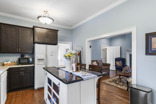 29 Roger Monk Rd, Petersburg, TN 37144 - kitchen featuring white appliances, crown molding, a kitchen bar, dark wood finished floors, and dark brown cabinetry