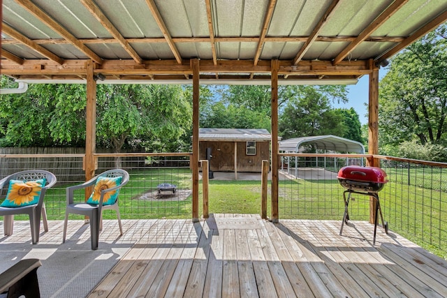 1818 Morningside Ave, Columbia, TN 38401 - wooden terrace with a carport, a grill, an outdoor fire pit, and view of wooded area