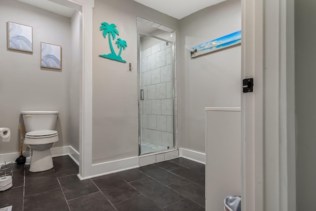 1818 Morningside Ave, Columbia, TN 38401 - full bathroom featuring a stall shower, toilet, baseboards, and tile patterned floors