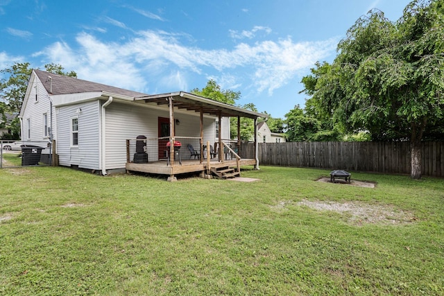 1818 Morningside Ave, Columbia, TN 38401 - rear view of house with a deck, a fire pit, and roof with shingles