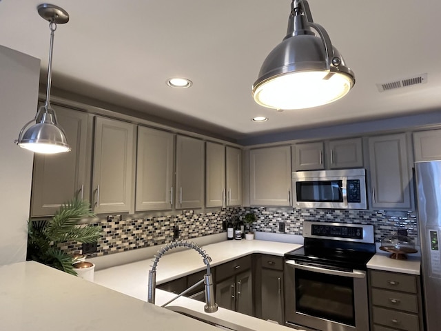 3201 Aspen Grove Dr Unit M4, Franklin, TN 37067 - kitchen with stainless steel appliances, light countertops, backsplash, gray cabinets, and recessed lighting