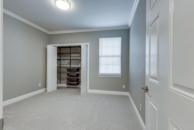 3201 Aspen Grove Dr Unit M4, Franklin, TN 37067 - unfurnished bedroom featuring ornamental molding, light colored carpet, baseboards, and a closet