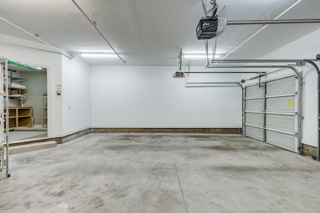 3201 Aspen Grove Dr Unit M4, Franklin, TN 37067 - garage with a garage door opener and baseboards
