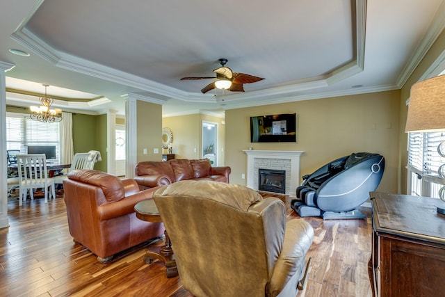 234 Glenn Springs Rd, Lawrenceburg, TN 38464 - living room with a raised ceiling, a chandelier, wood finished floors, a fireplace, and ceiling fan