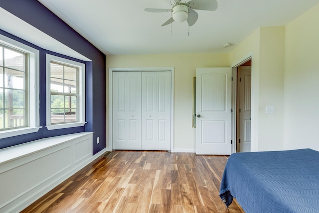 234 Glenn Springs Rd, Lawrenceburg, TN 38464 - bedroom featuring light wood finished floors, a closet, and ceiling fan