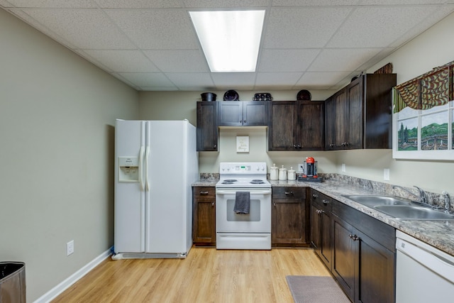 234 Glenn Springs Rd, Lawrenceburg, TN 38464 - kitchen featuring white appliances, a paneled ceiling, light wood-style floors, dark brown cabinets, and light countertops