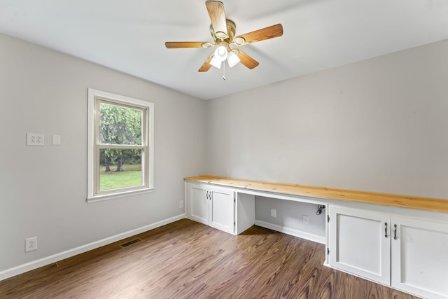 4312 Seminary Rd, Smyrna, TN 37167 - unfurnished office featuring built in desk, dark wood finished floors, baseboards, and a ceiling fan