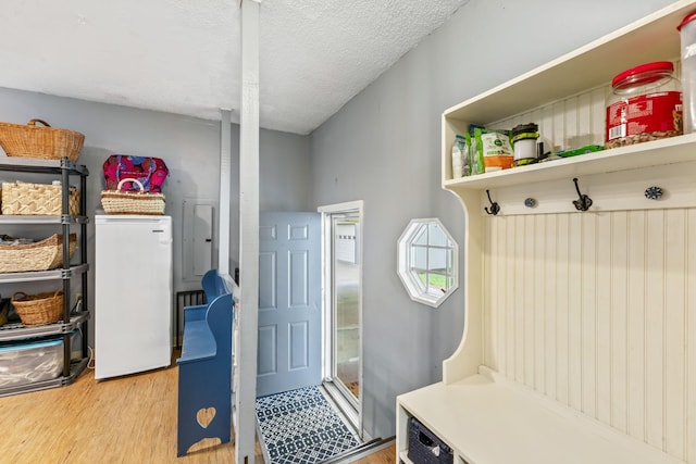 4312 Seminary Rd, Smyrna, TN 37167 - mudroom featuring wood finished floors, a textured ceiling, and electric panel
