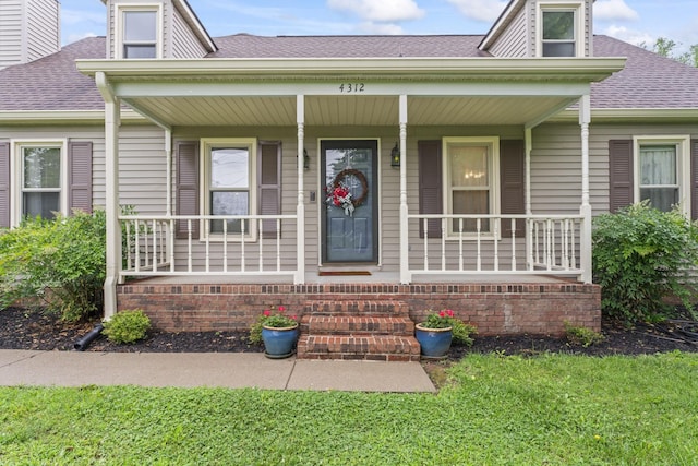 4312 Seminary Rd, Smyrna, TN 37167 - view of front of house featuring a shingled roof, a porch, and a front yard