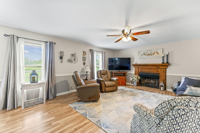 4312 Seminary Rd, Smyrna, TN 37167 - living area featuring a ceiling fan, a fireplace, light wood-type flooring, and baseboards
