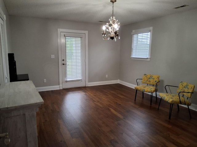 900 Sorghum Hollow Rd, Pulaski, TN 38478 - unfurnished room featuring a chandelier, dark wood-style flooring, and baseboards