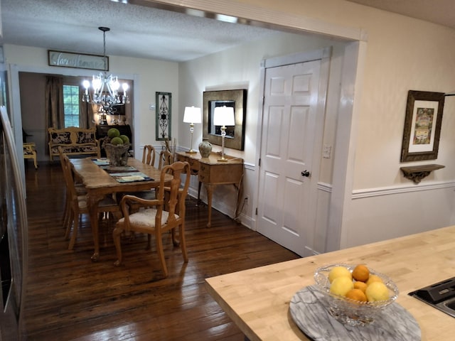 900 Sorghum Hollow Rd, Pulaski, TN 38478 - dining room with a chandelier, dark wood finished floors, and a textured ceiling
