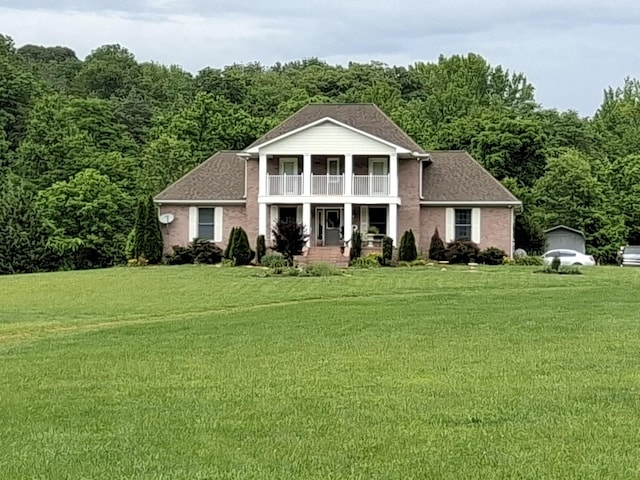 900 Sorghum Hollow Rd, Pulaski, TN 38478 - greek revival inspired property with a balcony, a porch, a front lawn, and a forest view