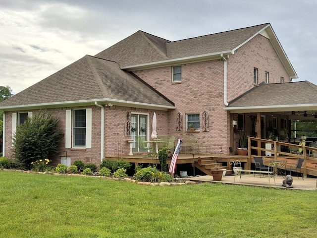 900 Sorghum Hollow Rd, Pulaski, TN 38478 - rear view of property featuring a shingled roof, brick siding, a wooden deck, and a yard