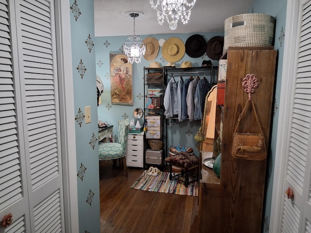 900 Sorghum Hollow Rd, Pulaski, TN 38478 - spacious closet featuring a chandelier and hardwood / wood-style floors