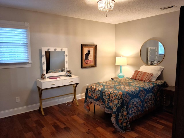 900 Sorghum Hollow Rd, Pulaski, TN 38478 - bedroom featuring wood finished floors, baseboards, and a textured ceiling