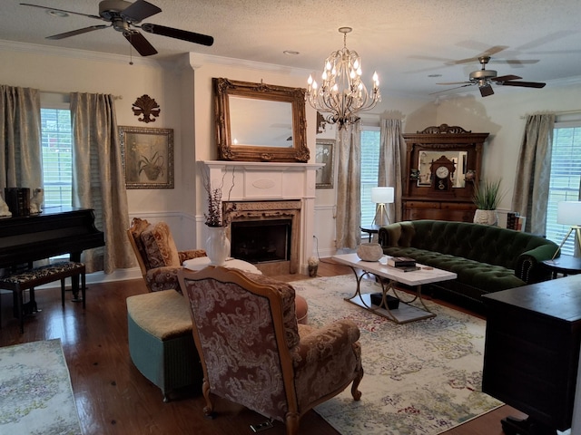 900 Sorghum Hollow Rd, Pulaski, TN 38478 - living area featuring a ceiling fan, ornamental molding, wood finished floors, a fireplace with flush hearth, and a textured ceiling
