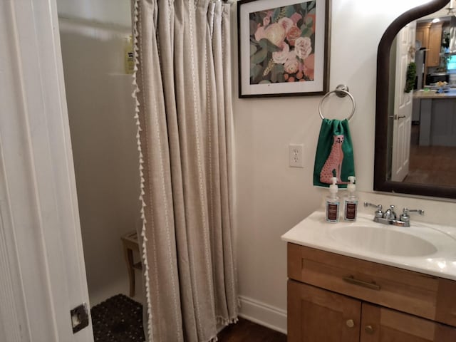 900 Sorghum Hollow Rd, Pulaski, TN 38478 - bathroom with vanity, baseboards, and wood finished floors